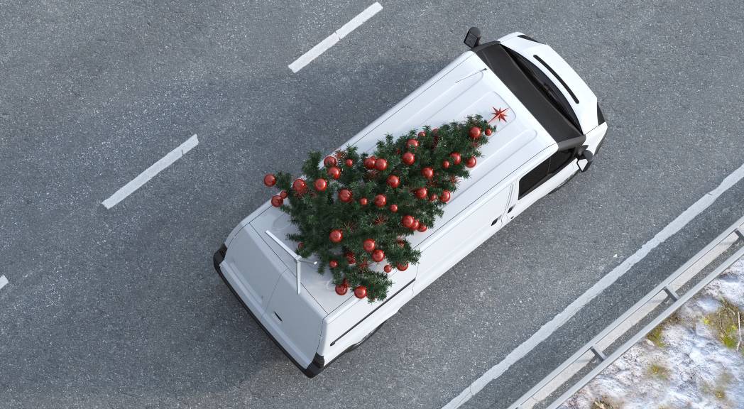 van with a Christmas tree on it